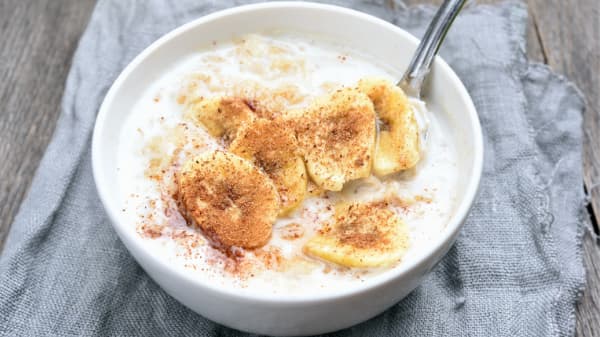 Green Banana Porridge With Fresh Ripe Banana And Cinnamon